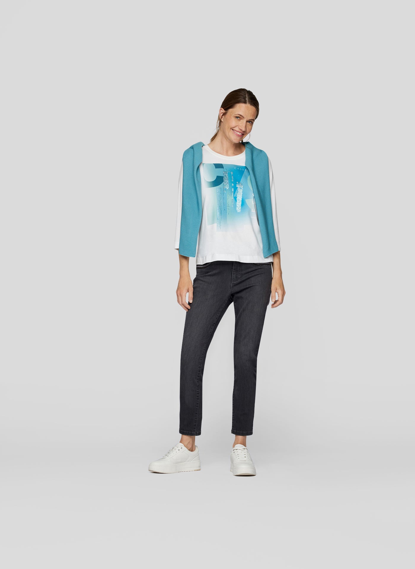 Cream Long Sleeve Top with Peacock Blue Graphic Print