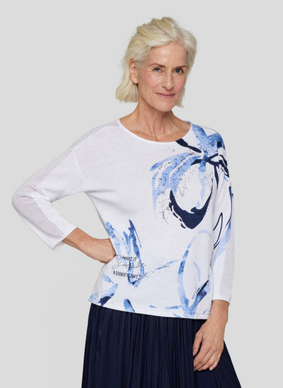 White Top with Navy Floral Design and Crochet Sleeve Detail