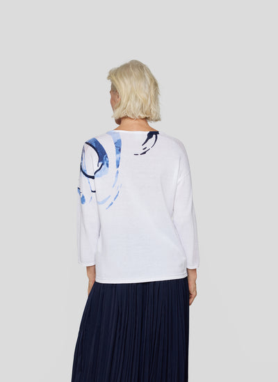 White Top with Navy Floral Design and Crochet Sleeve Detail